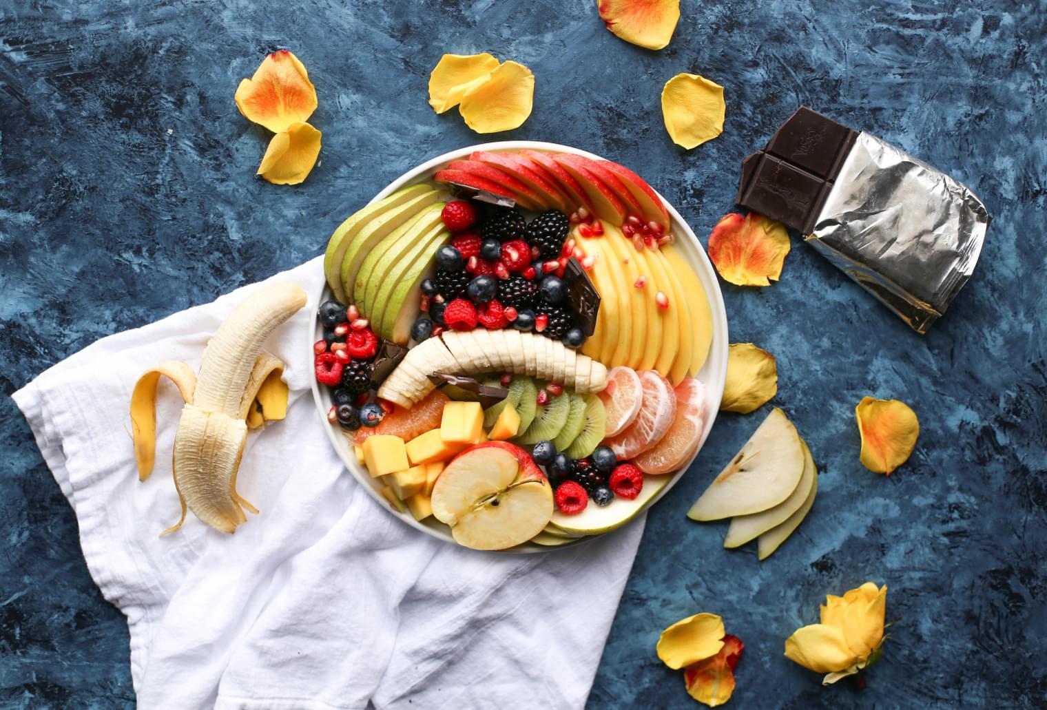 bowl of fruit on a blue marble background